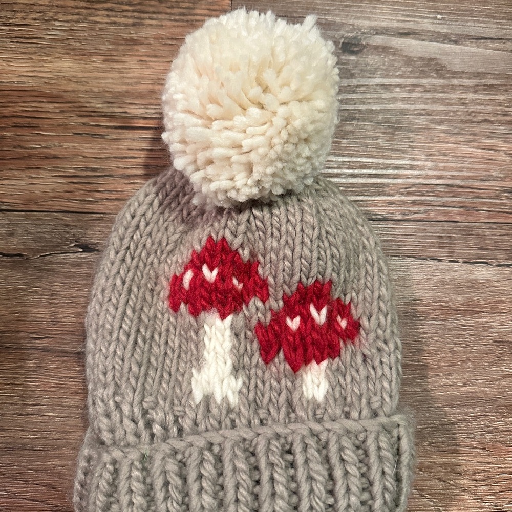 Adorable Knit Beanie with Red Mushroom Design